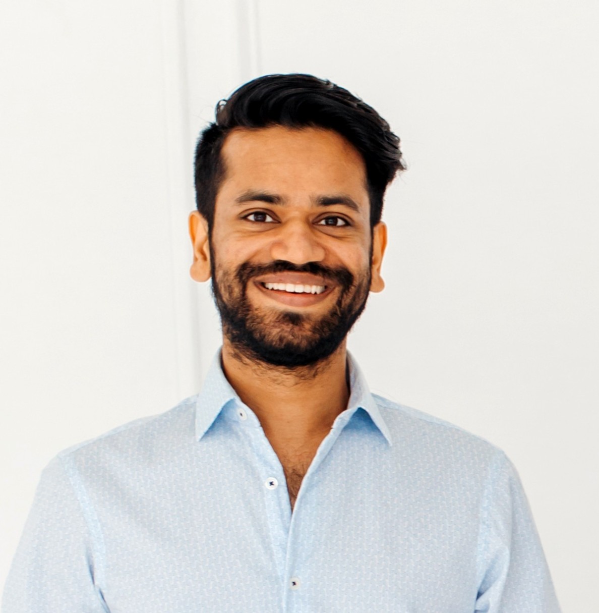Prabhat Garg smiling in a light blue shirt